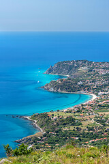 Naklejka na ściany i meble Vibo Valenzia district, Calabria, Italy, Europe, view from Mount Poro of the south coast of Capo Vaticano with the small bays of Coccorino in the foreground, in the background the beach of Santa Maria