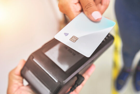 Close up of unrecognizable customer doing a contactless payment - Powered by Adobe