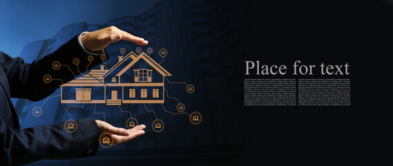 Real estate agent with digital projection of building on dark background with space for text