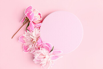 Beautiful peony flowers and blank card on color background © Pixel-Shot