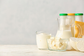 Different dairy products on light background