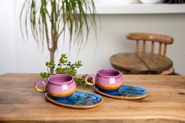 cup of coffee with handmade ceramic colorful coffee cups