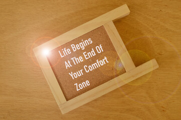 Motivational quote written with LIFE BEGINS AT THE END OF YOUR COMFORT ZONE