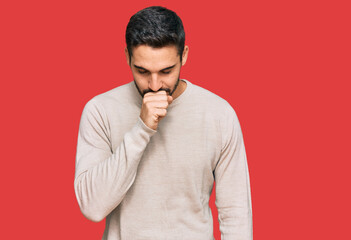 Young hispanic man wearing casual clothes feeling unwell and coughing as symptom for cold or bronchitis. health care concept.