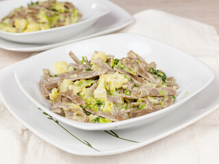 Pizzoccheri Valtellina with cabbage and potatoes. Vegan recipe