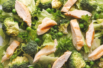 Tasty salad with fresh vegetables and chicken as background
