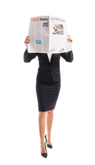 Young businesswoman reading newspaper on white background