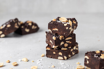 chocolate Fudge with salted peanuts on the table pyramid sweet dessert