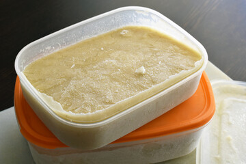 Frozen soup in a plastic box container.  Potato leek soup in a box.  Photo can be used for the...