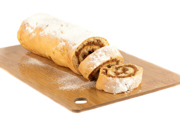 Sliced apple roll on a wooden cutting board.