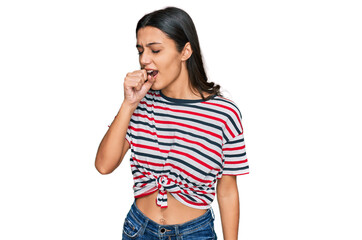 Young hispanic girl wearing casual clothes feeling unwell and coughing as symptom for cold or bronchitis. health care concept.