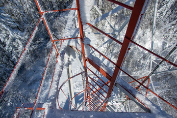 Tower with antennas connection in the mountains against the blue sky