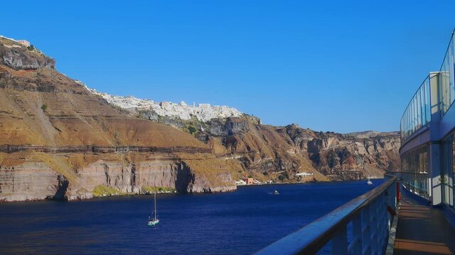 View from the deck of a cruise ship of the coast of the Greek island of Santorini