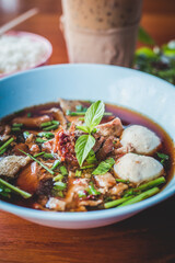 stewed Beef noodle soup, Noodle soup thai style put blood in the soup hot for mellow soup (Pork or Beef) on wooden table