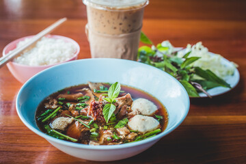 stewed Beef noodle soup, Noodle soup thai style put blood in the soup hot for mellow soup (Pork or Beef) on wooden table