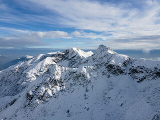 Fototapeta na wymiar peak of the mountain view, partially cloudy day, italian alps