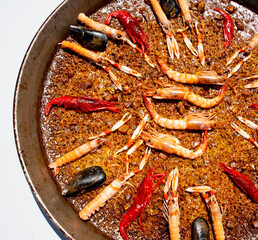 Traditional seafood paella in the fry pan