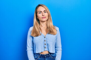 Young caucasian woman wearing casual clothes relaxed with serious expression on face. simple and natural looking at the camera.