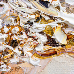 .Embossed pasty oil paints and reliefs. Primary colors: brown, white, yellow, orange. Abstract art. Mix of paints.