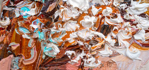 .Embossed pasty oil paints and reliefs. Primary colors: brown, white, blue, orange. Abstract art. Mix of paints.