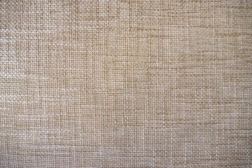 Closeup fabric in warm brown tone with texture and rough surface for background and decoration