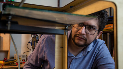 man developing an object on 3d printer