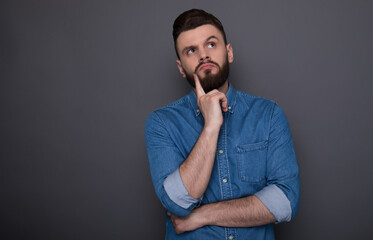 Beautiful modern smart confident man has some ideas while thinking process