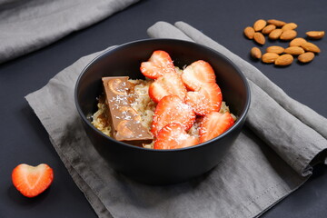 Oatmeal with strawberries. Cooking. Food.