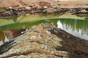 Dirty bottom of a dried-up lake. Ecological problems.