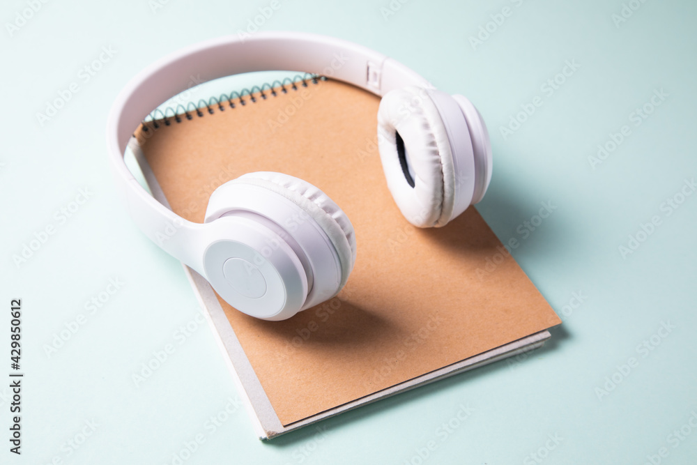 Wall mural earphone on notepad on table