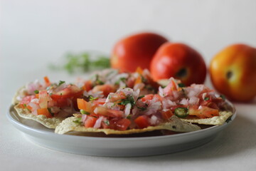 Crisp and fried papads topped with a masala filling of onions, tomatoes and spices. Popular starter from North India commonly known as masala papad.