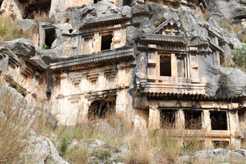 Fototapeta premium ancient monumental lycian rock-cut tombs in archaeological site Myra near Demre, Turkey