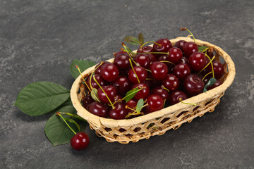 Fototapeta na wymiar Sweet ripe cherry with leaves