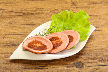 Roasted sausage slice in the plate