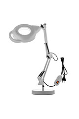 Table lamp with a magnifying glass. Magnifying glass with illumination on a white back