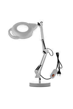 Table lamp with a magnifying glass. Magnifying glass with illumination on a white back