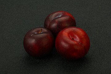 Ripe sweet plum fruit heap