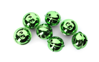 Shiny green sleigh bells on white background, top view