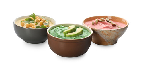 Different kinds of tasty hummus in bowls on white background