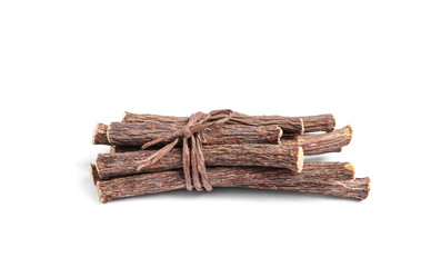 Dried sticks of liquorice root on white background