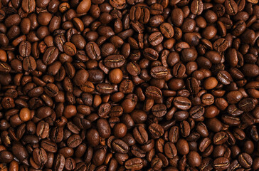 Coffee beans background close up.