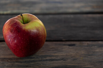 Fresh apple of the gala variety on wooden background
