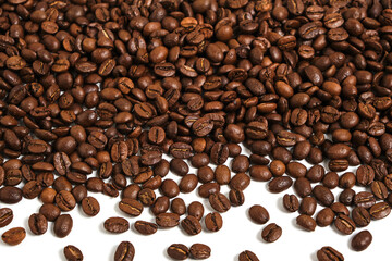 Roasted coffee beans on white background.