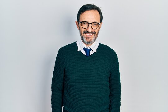 Middle age hispanic man wearing casual clothes and glasses with a happy and cool smile on face. lucky person.