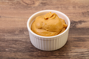 Obraz na płótnie Canvas Peanut butter in the bowl