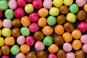 A background of colourful round candies 