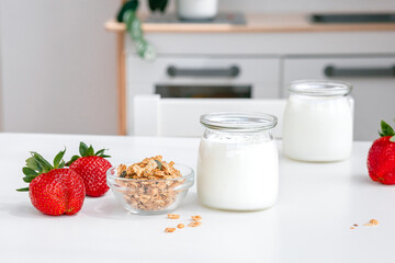 Greek yogurt with fresh strawberries and oatmeal for breakfast for children