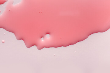 Liquid pink gel or serum glass of microscope background