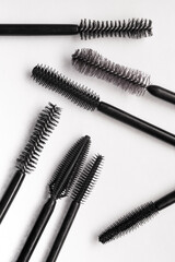 Assortment of brushes of black mascara texture