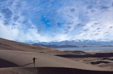 Walking over sand dunes in Ngari, Western Tibet, China